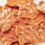 homemade almond brittle on a plate.