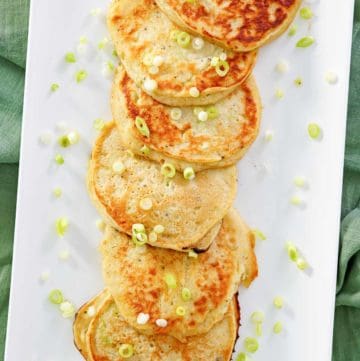 overhead view of mashed potato pancakes on a platter.