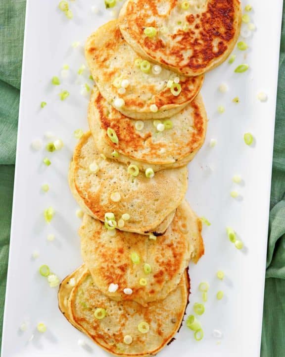 overhead view of mashed potato pancakes on a platter.