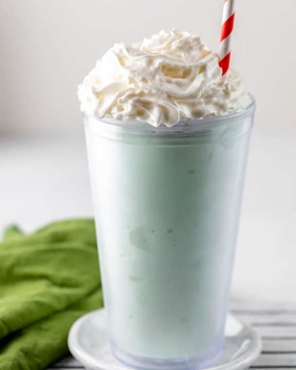homemade McDonald's Shamrock Shake and a green kitchen towel.