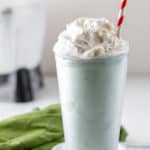 homemade shamrock shake topped with whipped cream.