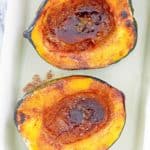 overhead view of microwave acorn squash with brown sugar butter sauce.