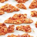 microwave peanut brittle pieces on parchment paper.