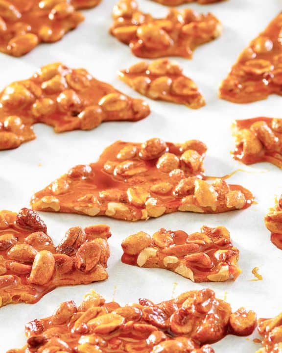 microwave peanut brittle pieces on parchment paper.