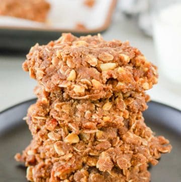 a stack of no bake chocolate oatmeal cookies on a plate.