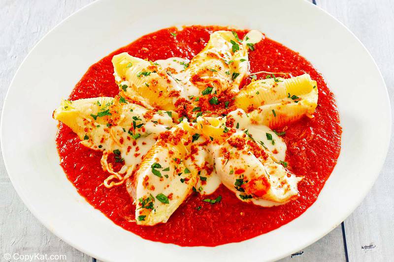 a bowl of homemade Olive Garden giant cheese stuffed shells.