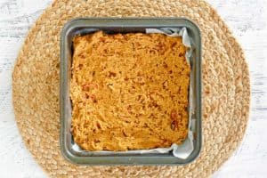 pecan pie brownies batter in a baking pan.