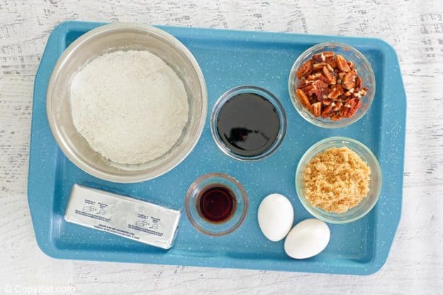 pecan pie brownies ingredients on a tray.