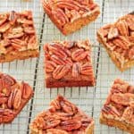 pecan pie brownies scattered on a wire rack.
