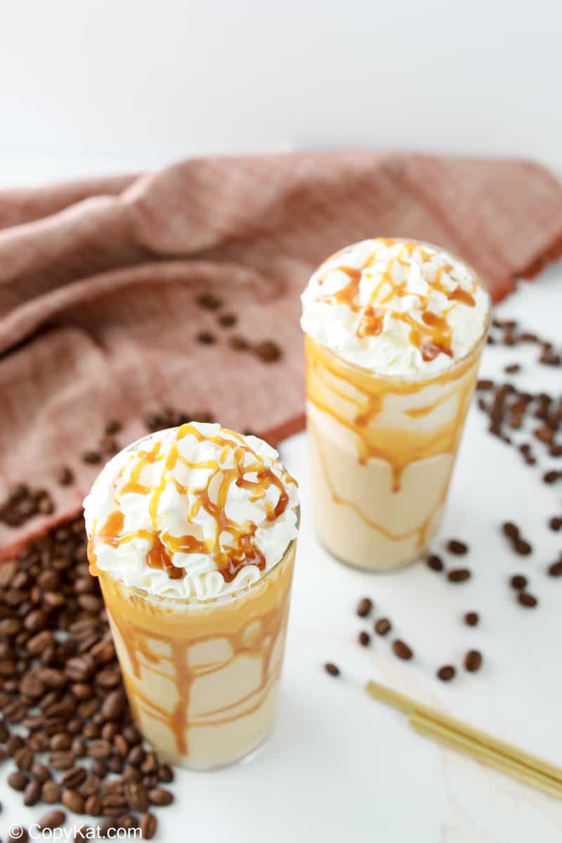 two homemade Starbucks caramel frappuccino drinks.