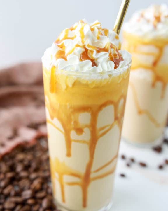 homemade Starbucks caramel frappuccino with whipped cream and caramel sauce.