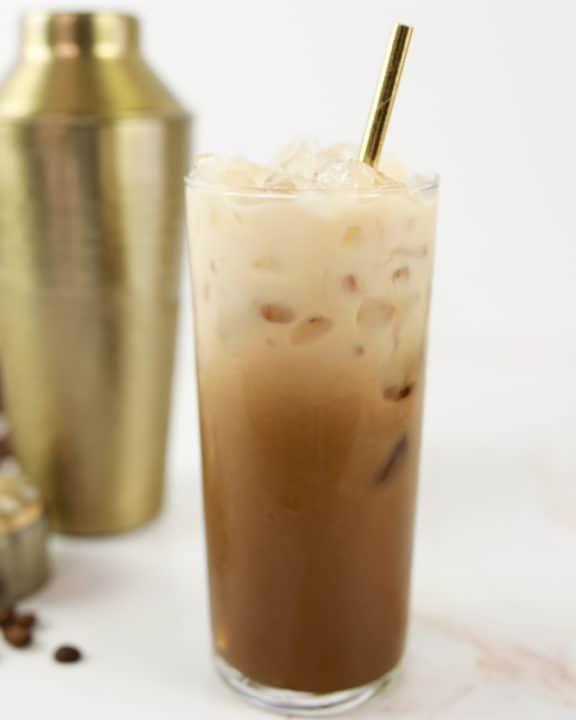 homemade Starbucks iced brown sugar oatmilk shaken espresso coffee drink in a glass.