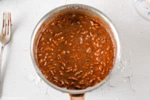 Texas sheet cake frosting in a saucepan.