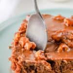 a slice of Texas sheet cake with a spoon in it.