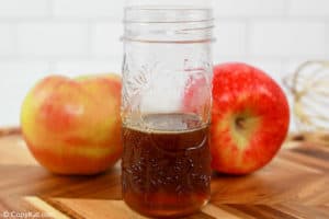 apple cinnamon syrup in a glass jar.