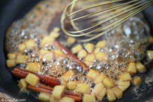 apple cinnamon syrup cooking in a pan.