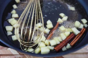 apple cinnamon syrup ingredients in a pan.
