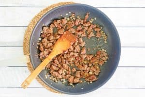 browned ground sausage and onions in a skillet