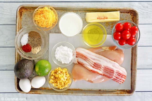 Chick Fil A cobb salad and dressing ingredients on a tray.