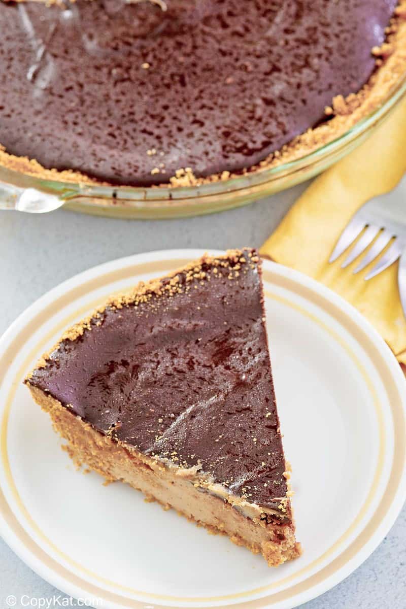 chocolate peanut butter pie slice beside the pie.
