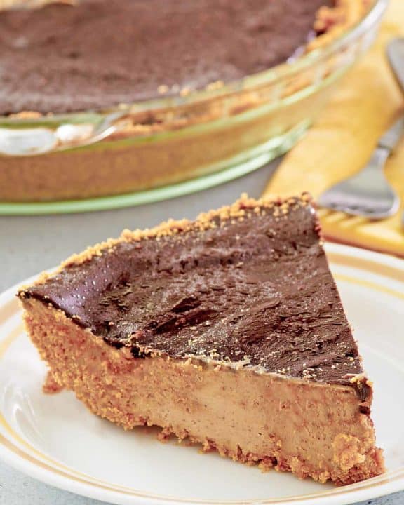 slice of chocolate peanut butter pie in front of the pie.