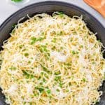 overhead view of garlic butter pasta in a serving bowl.