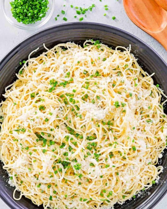 overhead view of garlic butter pasta in a serving bowl.