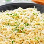 garlic butter pasta in a large black serving bowl.