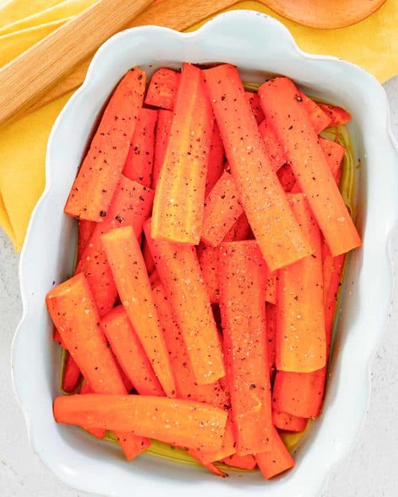 overhead view of honey roasted carrots in a serving dish.