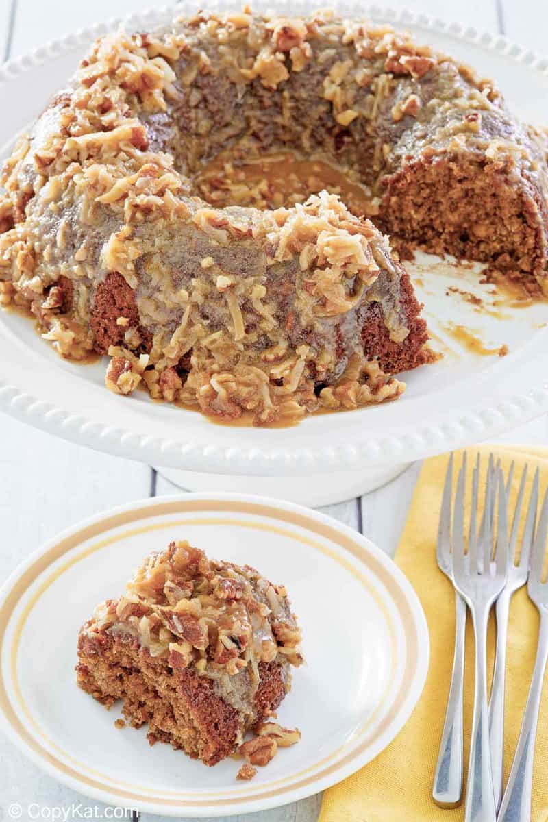 oatmeal cake slice on a plate and the cake on a cake stand.