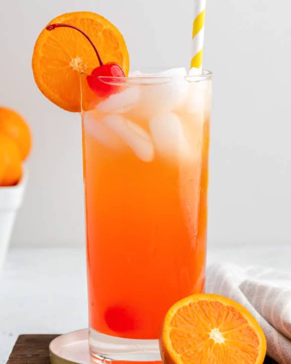 homemade Olive Garden Venetian Sunset drink garnished with a cherry and orange slice.