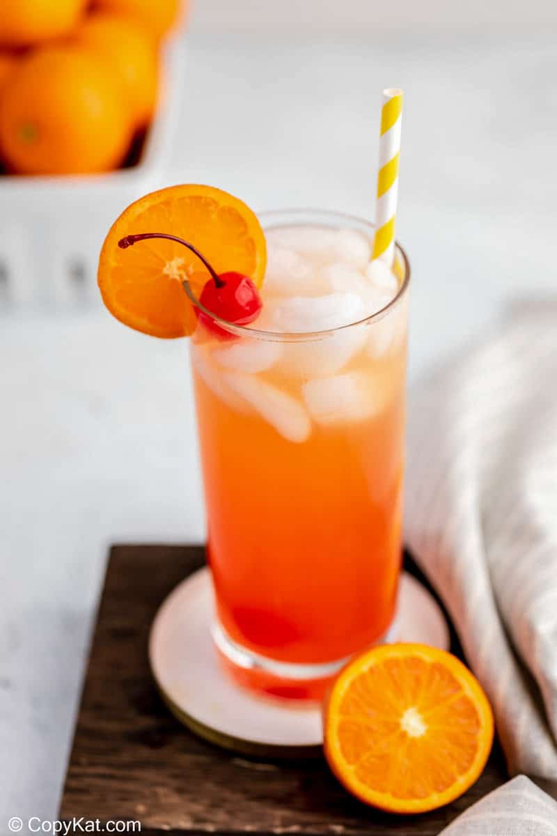homemade Olive Garden Venetian Sunset drink and an orange slice.
