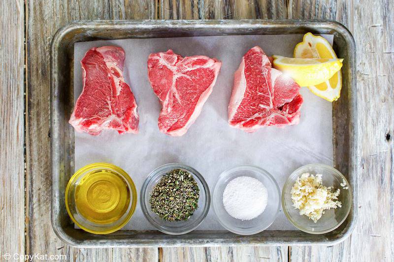 pan seared lamb chops ingredients on a baking sheet.