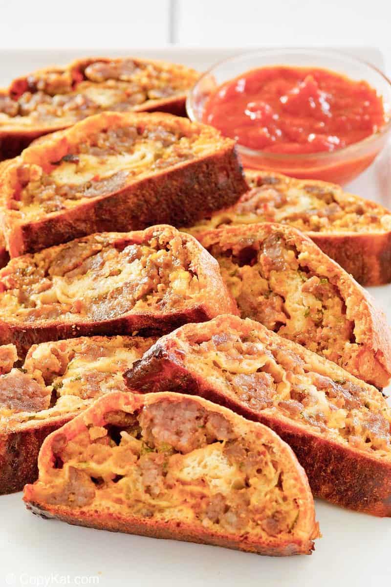 sausage roll slices and picante sauce.