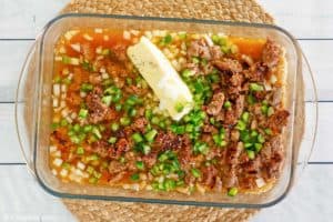 sausage and rice casserole in a baking dish before baking.