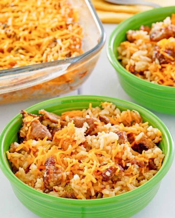 sausage and rice casserole in two bowls and a baking dish.