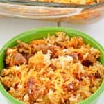a bowl of sausage and rice casserole in front of the casserole.