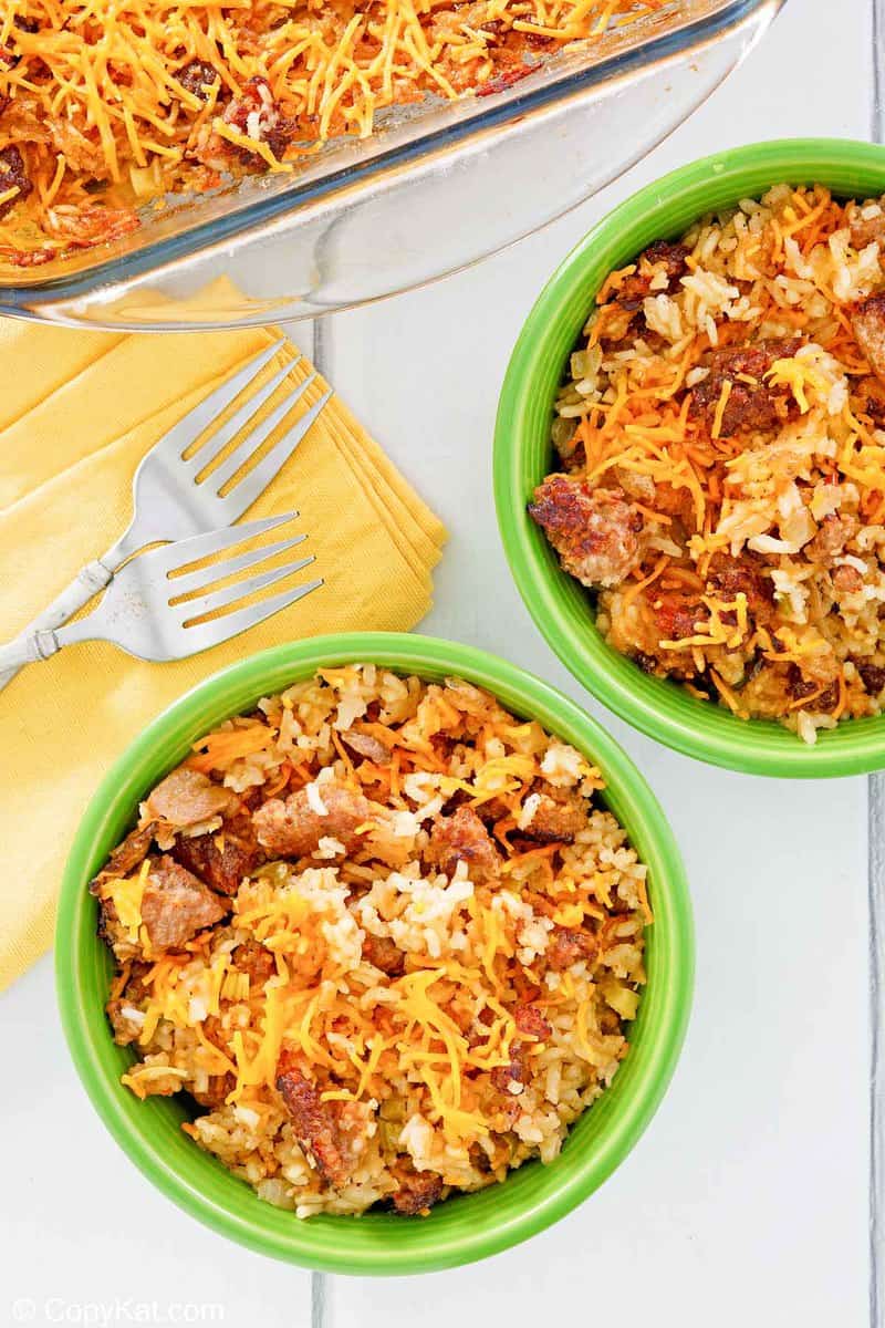 overhead view of sausage and rice casserole in bowls and baking dish.