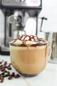 homemade Starbucks cafe mocha coffee drink with whipped cream and chocolate syrup.