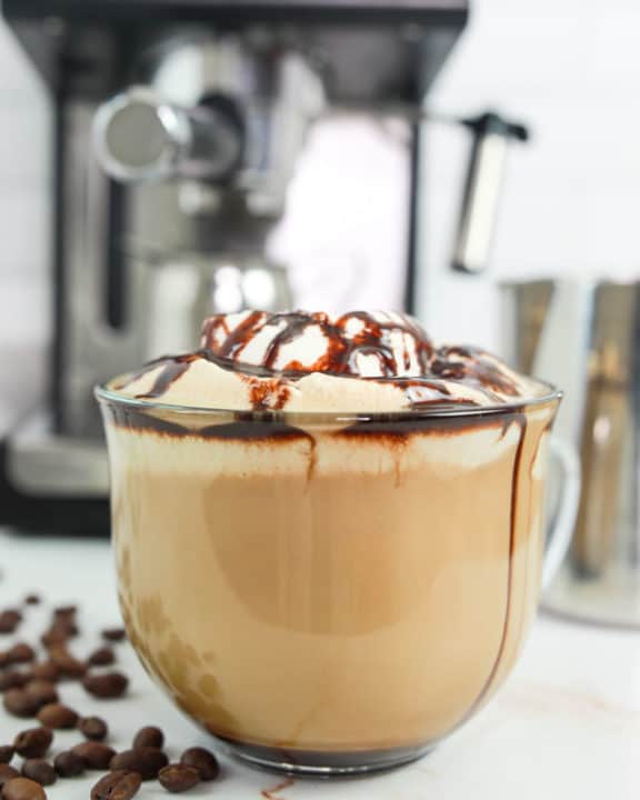 homemade Starbucks cafe mocha coffee drink with whipped cream and chocolate syrup.