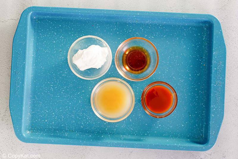 Starbucks caramel apple spice ingredients on a tray.
