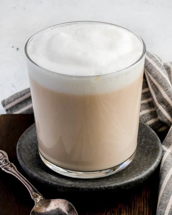 Homemade Starbucks London Fog Earl Grey Tea Latte and a spoon.