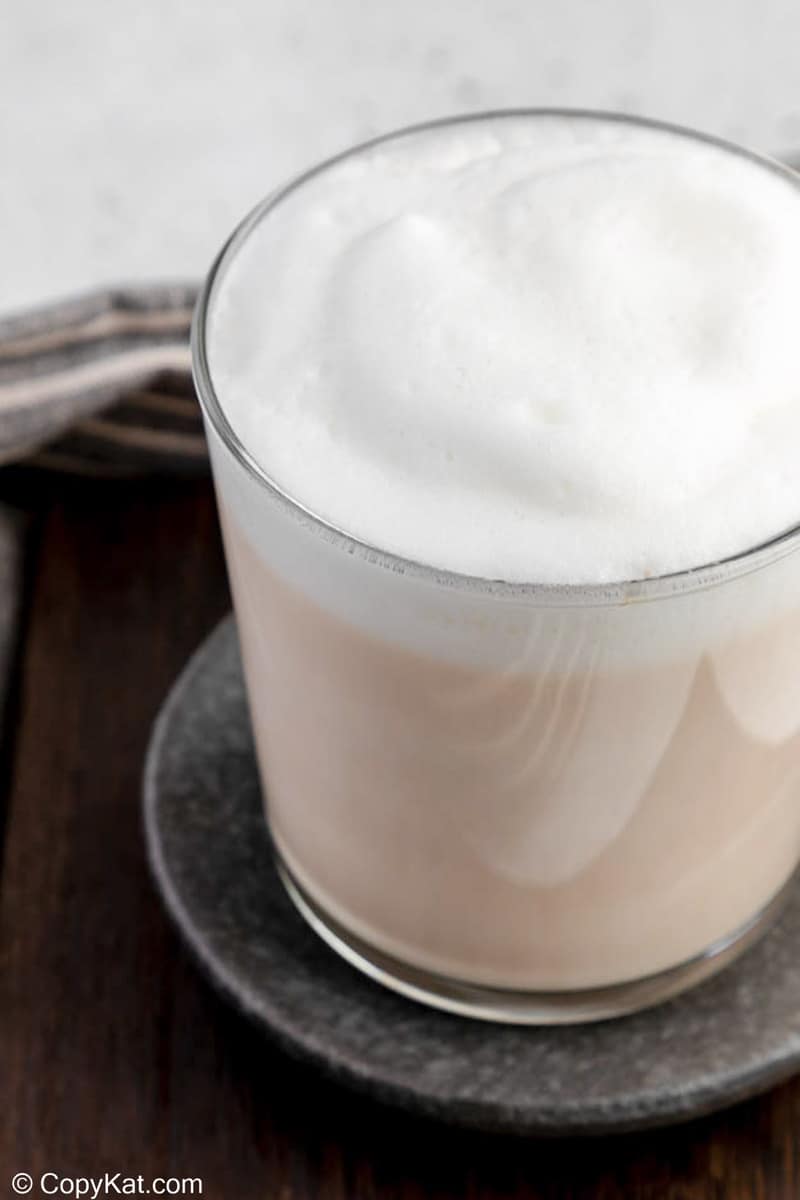 homemade Starbucks London Fog tea latte on a coaster.