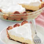 tiramisu cheesecake in a pie plate and a slice on a plate.