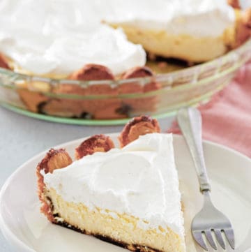 tiramisu cheesecake in a pie plate and a slice on a plate.
