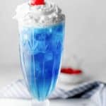 Homemade Ruby Tuesday Blue Smurf Punch Drink and a cherry.