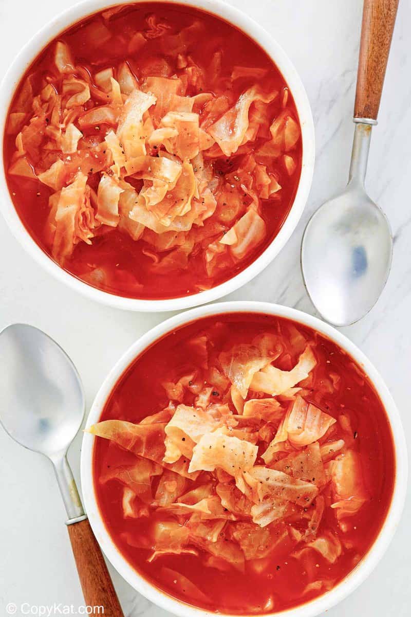 overhead view of cabbage soup in two bowls.