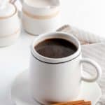cinnamon coffee, cinnamon sticks, sugar bowl, and cream pitcher.