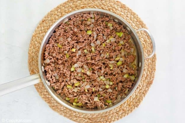 cooked browned ground beef and vegetable mixture in a pan.