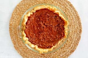 German chocolate pie filling in a baked pie crust.